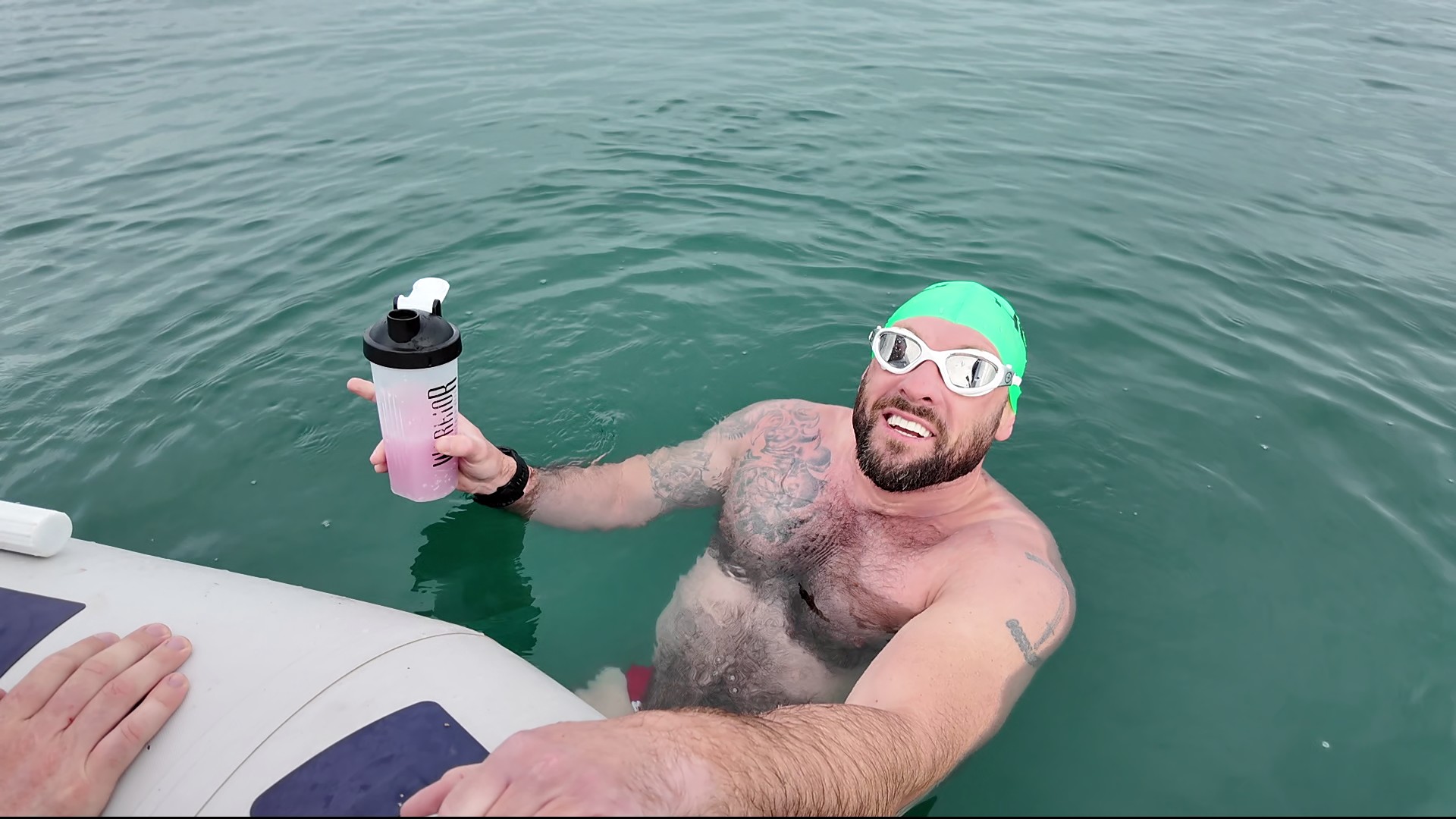 Dale Hardiman swimming in open water at first light